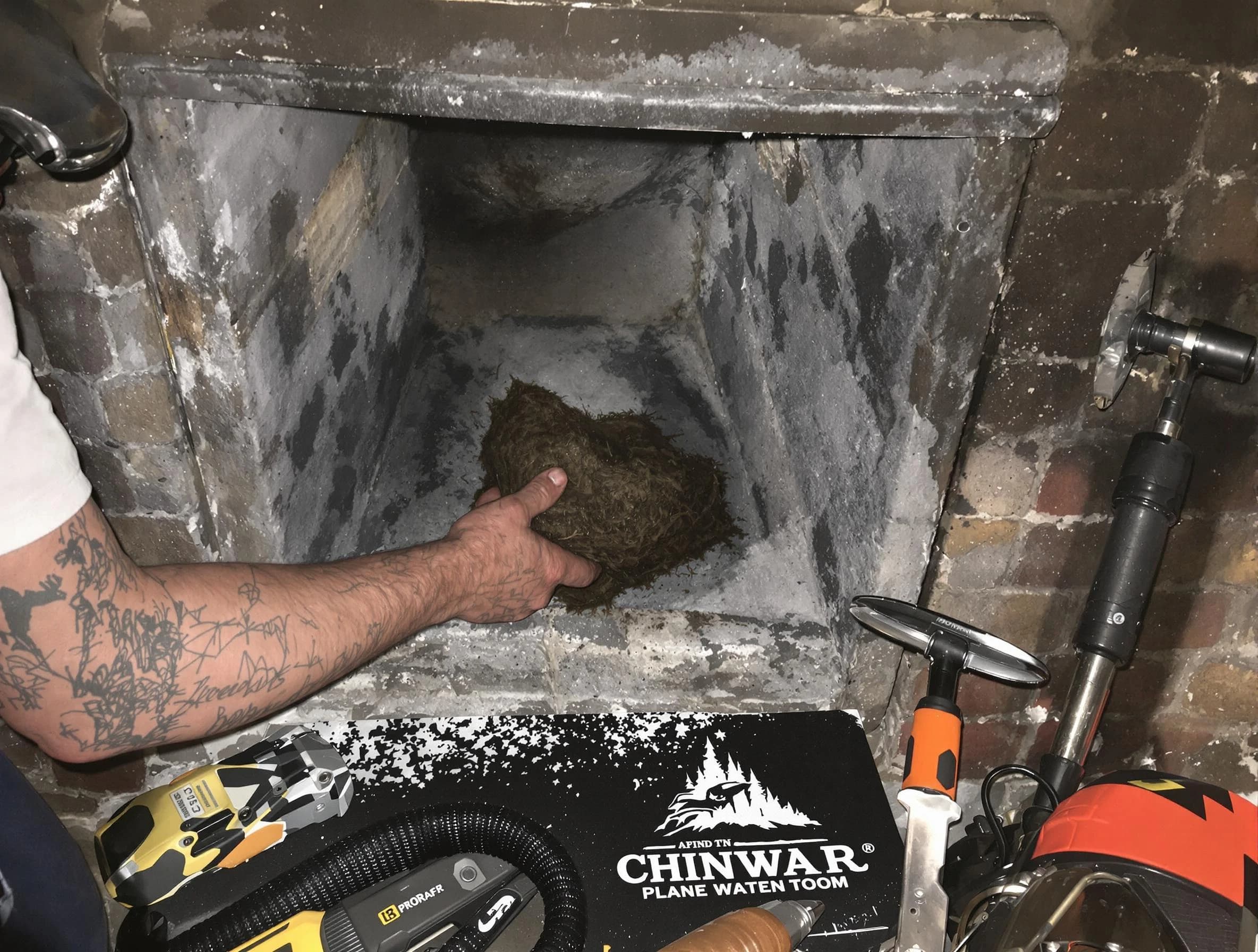 West Jordan Chimney Sweep safely removing debris and screening chimney in West Jordan, UT